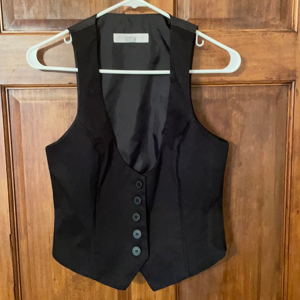 Size 6- black vest. Adjustable back.